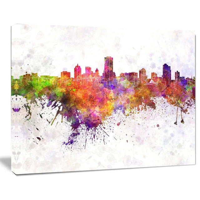 Design Art Milwaukee Skyline Canvas Print featuring a gallery wrapped cotton canvas with an abstract watercolor cityscape in vibrant green, orange, purple, and red hues, printed with high-resolution giclée inks and ready to hang with included hardware.