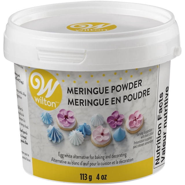 Wilton Meringue Powder 113 g (4 oz) container with white lid and yellow logo, displaying pastel blue and pink meringue cookies on a marble background. This egg white alternative is ideal for baking ingredients like meringues and royal icing, with nutrition facts on the side.