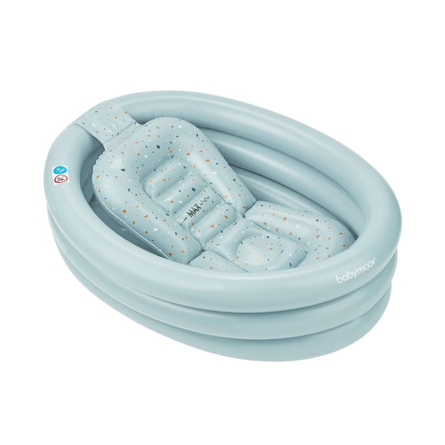 Babymoov Inflatable Bathtub & Pool in light blue with a removable speckled infant seat insert featuring orange and dark blue flecks, designed for newborn support and easy transition as baby grows, with a sturdy triple-ring inflatable base for stability and travel convenience.