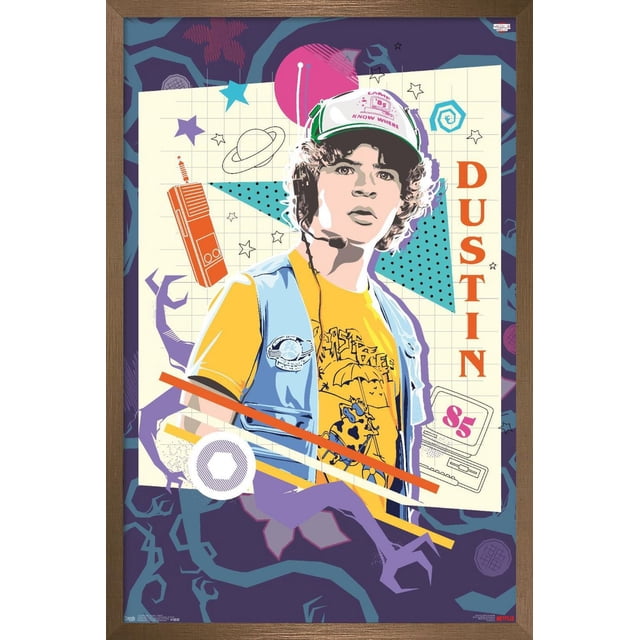 Netflix Stranger Things: Season 3 - Dustin Wall Poster, 14.725" x 22.375" framed featuring a graphic illustration of Dustin wearing a white and green cap, headphones, a yellow t-shirt with a cartoon design, and a blue vest. The background includes retro tech icons like a walkie-talkie and vintage computer, stars, and geometric shapes in purple and blue. The name 'DUSTIN' appears vertically in orange on the right. This lightweight framed poster with a satin finish is easy to hang using a sawtooth hanger, suitable for home décor or themed parties.