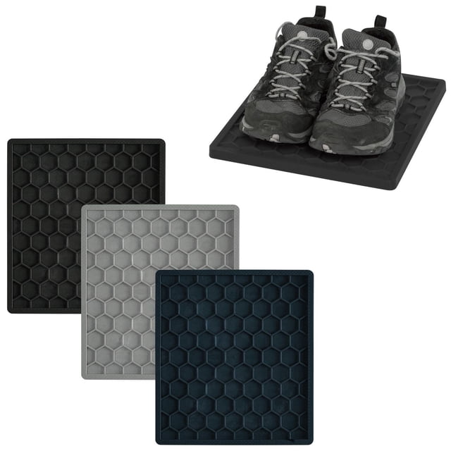 Merangue Locker Boot Tray in assorted colours featuring a honeycomb grid pattern that traps mud, snow, and dirt. Measuring 11 by 12 inches, these boot trays fit standard lockers and are suitable for schools, homes, or cars. One tray holds a pair of black and grey shoes, demonstrating its use for keeping floors clean.