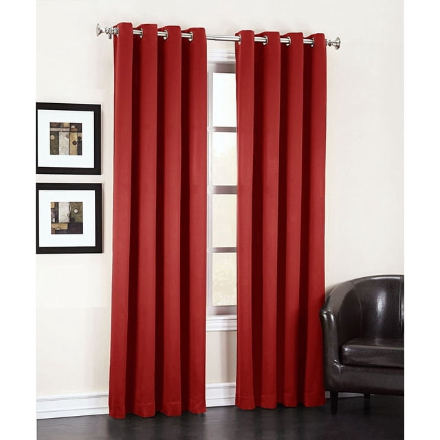Sun Zero Madrid Grommet Curtains in red, set of two 40 by 63 inch room darkening energy efficient panels with grommet tops on a silver rod, displayed in a modern room with white walls, black framed abstract art, and a black leather chair. Suitable for blocking sunlight and enhancing privacy.