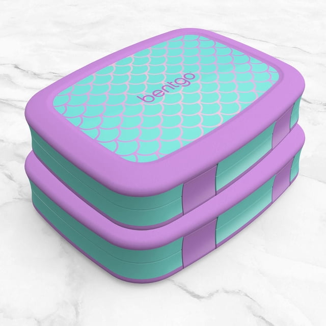 Bentgo Kids Prints 2-Pack - Mermaid Scales lunch boxes stacked, featuring turquoise lids with purple mermaid scale patterns and purple rubber-coated edges, leak-proof with easy-open latches for kids ages 3-7, suitable for packing varied meals.
