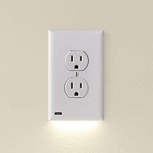 SnapPower GuideLight for outlets, new version with LED light bar, shown installed on a duplex electrical outlet wall plate in white. The wall plate features a softly diffused LED night light at the bottom, providing an elegant pathway light. Designed with an automatic on/off sensor and patented prong design for easy installation without batteries or wires.