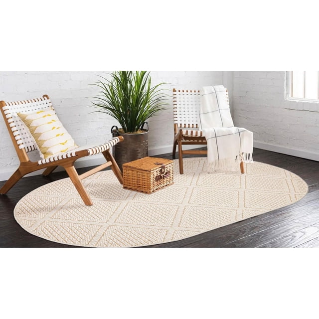ECARPET Jute Style Area Rug for Bedroom, Living Room, Dining Room Tosca Collection features an oval jute-style rug with a textured geometric pattern in sand and ivory tones on dark hardwood floors, paired with two wooden chairs with white woven seats, a wicker basket, and a green potted plant, ideal for high-traffic indoor spaces.