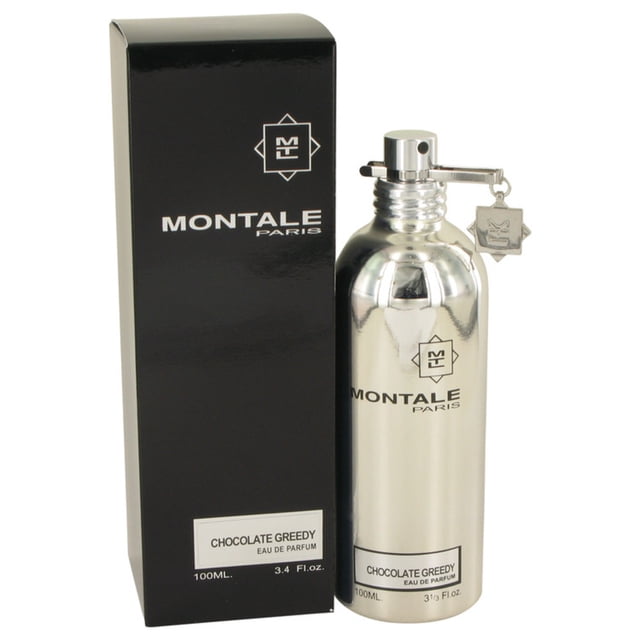 Montale Chocolate Greedy Eau de Parfum for him/her 100ml, a unisex fragrance in a sleek silver bottle with a matching charm, displayed alongside its black packaging. This perfume features notes of bitter orange, dry fruits, cocoa, coffee, tonka bean, and bourbon vanilla, offering a sweet and warm chocolate scent.