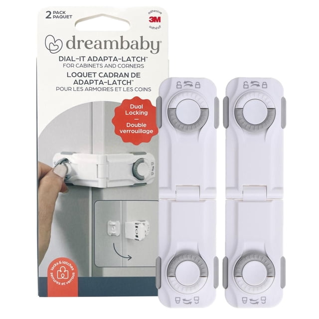 Dreambaby® Dial-It Adapta™ Angle Lock 2-pack with two white plastic safety locks featuring grey dials for dual locking on cabinets and corners, using strong 3M adhesive for easy tool-free installation, shown on packaging with hand demonstrating lock use and corner mounting illustration.