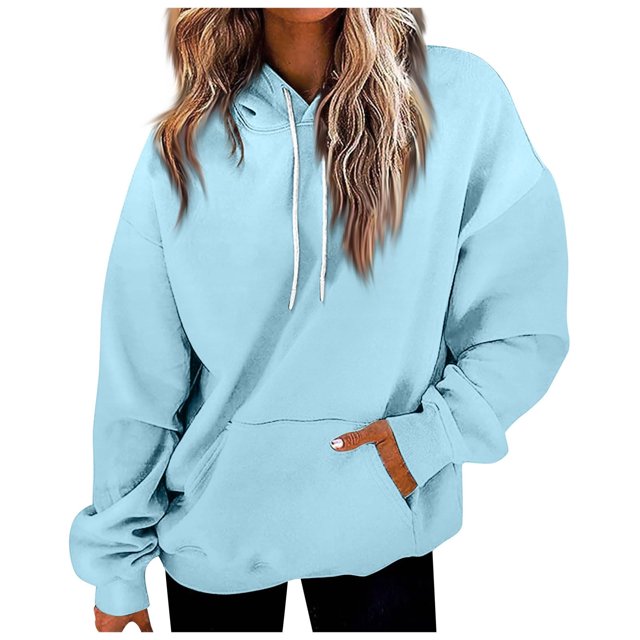Timegard Hoodies for Women Drawstring Long Sleeve Sweatshirts Pullover Fall Winter Solid Color Tops. The image shows a light blue hoodie with a drawstring hood, long sleeves, and a front pocket. Made of soft, breathable fabric, it is designed for comfort and warmth during fall and winter. The hoodie is styled casually, suitable for pairing with leggings, jeans, or joggers. The model is wearing the hoodie in a relaxed fit.
