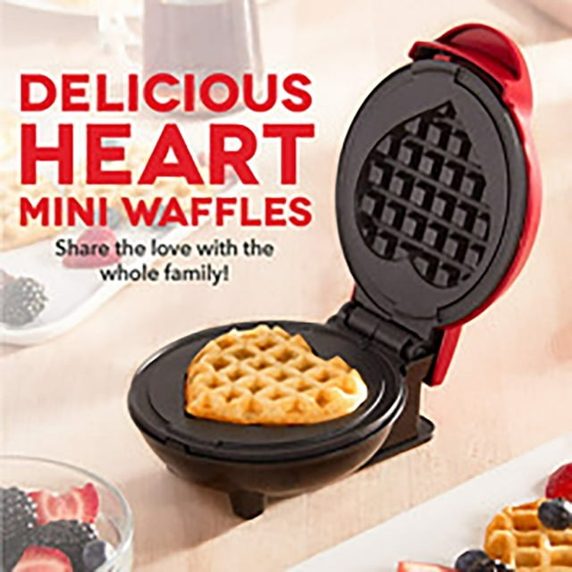 LOVEVER Mini Waffle Maker Machine in red with a heart-shaped non-stick cooking surface, shown open with a cooked heart-shaped waffle inside. Compact and portable, ideal for making waffles, paninis, hash browns, and other snacks. Features easy-to-clean non-stick sides and cool-touch handles. Perfect for small kitchens, dorms, or RVs.
