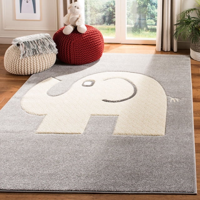 Safavieh Carousel Kids Tapis Éléphant d'Automne avec un Motif d'Éléphant Crème Esquissé en Gris Foncé sur un Fond Gris Atténué, Tissé Mécaniquement à Partir de Fils Synthétiques Durables pour Chambres d'Enfants, Exposé dans un Espace Lumineux avec des Planchers en Bois, des poufs Tricotés et un Jouet en Peluche, Convient pour Ajouter un Confort Ludique à la Déco des Enfants.