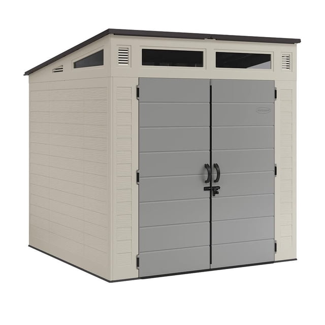 Suncast Modernist 7' x 7' Resin Storage Shed - Vanilla/Dove Gray front-facing full view of a 7 ft x 7 ft resin storage shed with reinforced resin floor, double pad-lockable doors (resin handles, metal slide latch), four transom windows, vents and dove gray roof accents; suitable for storing mowers or firewood.