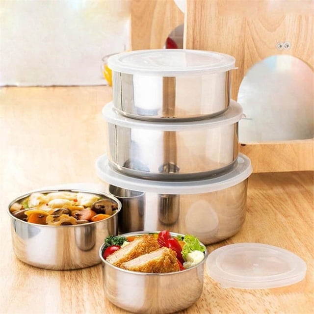 Dvkptbk Bowls 5 Pcs Stainless Steel Home Kitchen Food Container Storage Mixing Bowl Set, a set of five nesting bowls with clear plastic lids. Displayed on a wooden countertop, two bowls contain food while three are stacked with lids. Perfect for meal prep, leftovers, and kitchen storage. Suitable as kitchen gadgets or mixing bowls.
