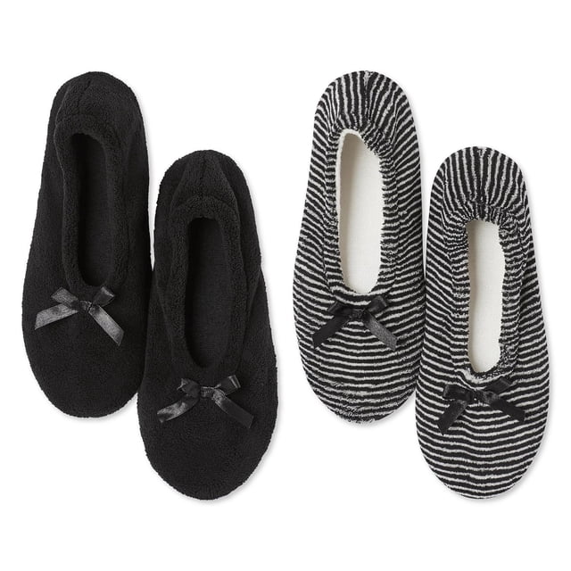 George Women's Slippers 2-Pack includes two pairs of slip-on slippers with round toes and front bow details; one pair is solid black plush micro terry, the other pair features black and white stripes, both with rubber outsoles and grippers for traction, suitable for indoor warmth and comfort.