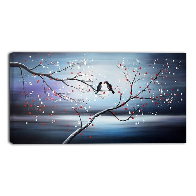 Design Art Together Forever Birds Canvas Art depicting two black birds perched on a curved tree branch with red and white blossoms, printed on gallery-wrapped cotton canvas with a 1-inch wood sub frame, set against a blue-gray gradient background, ready to hang with included hardware, suitable for enhancing home or office wall décor.