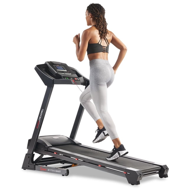 Sunny Health & Fitness Premium Smart Treadmill SF-T7515SMART with auto incline, quick speed buttons, and double deck cushioned running surface, shown with a person running, featuring a digital performance display and pulse sensors for heart rate tracking, ideal for low-impact home workouts with Bluetooth connectivity to access over 1000 workouts and global running routes.