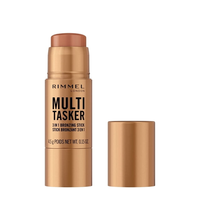 Multi Tasker Bronzing, Sculpting & Contour Stick by Rimmel London, a 3-in-1 creamy bronzing stick in a metallic bronze cylindrical tube with black text, showing the stick extended and the cap removed, 4.5g (0.15 oz) net weight, vegan formula with a dewy finish and light-reflective pigments, ideal for sculpting and adding a radiant glow.