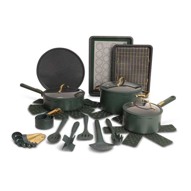Thyme & Table 32-piece aluminum cookware set in green featuring three saucepans with lids, two fry pans, measuring cups and spoons, assorted utensils, and bakeware including sheet pans and a pizza pan, arranged on green silicone trivets for versatile kitchenware use.