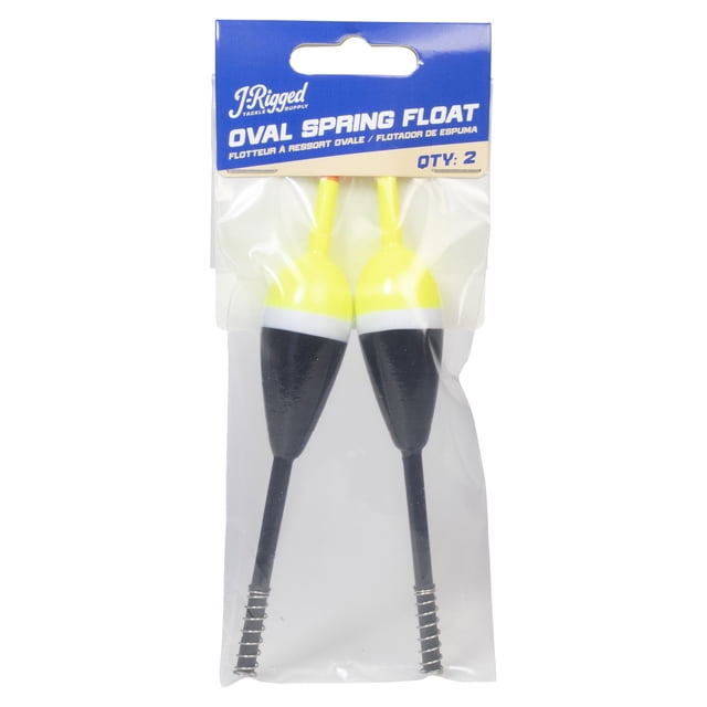 J-Rigged Tackle Supply Balsa Oval Spring Float pack with two oval fishing floats featuring high-visibility yellow tops, white bands, and black lower bodies, each with a spring attachment for quick rigging, enclosed in clear plastic packaging with a blue header card.