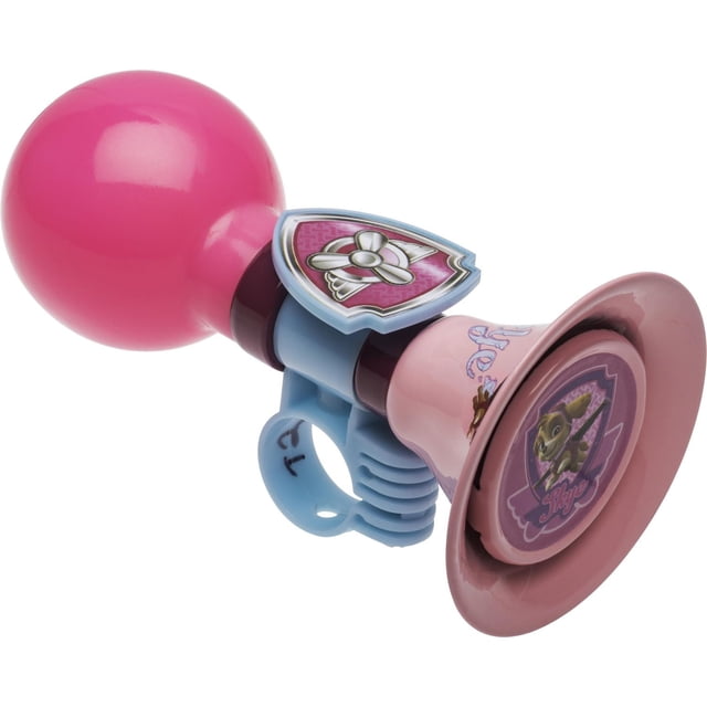 Paw Patrol™ 3D Skye Bicycle Horn with a pink rubber squeeze bulb and light pink metal horn featuring a 3D Skye badge, attached to a light blue plastic clamp for bike handlebars, suitable for children aged 3 and up to enhance safety and style.