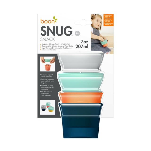 Boon SNUG Snack Set with Universal Lids featuring four stackable silicone snack containers in white, mint green, orange, and navy blue, each holding 7 oz (207 ml). Flexible silicone lids fit cups with 3.25 to 4 inch diameter to create spill-proof snack holders, made without BPA, PVC, and phthalates, ideal for toddler feeding and snack storage.