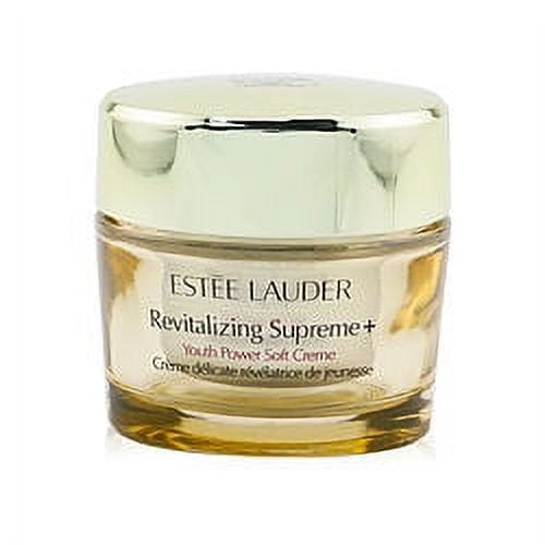 Revitalizing Supreme + Youth Power Soft Creme by Estée Lauder in a 50ml (1.7oz) jar. The jar features a gold-toned lid and a clear base showcasing the cream inside. Designed for face care, this moisturizer is part of the Estée Lauder skincare line, introduced in 1968, with fragrance notes of citrus, sweet fruits, flowers, and sandalwood. Suitable for romantic use.