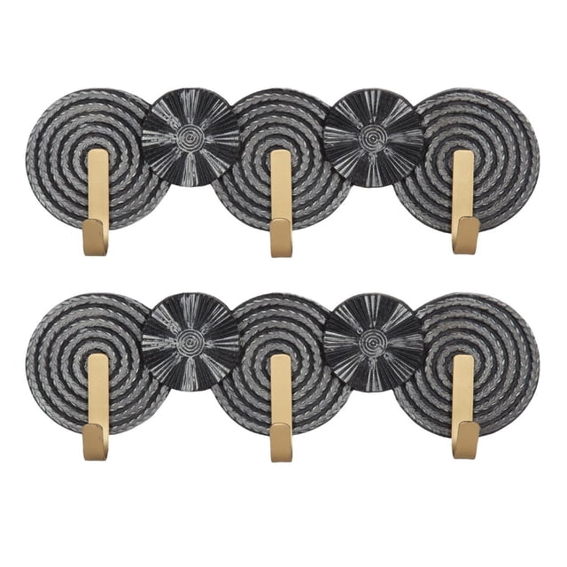 hometrends Spinoza Plaque with Hooks Set, black and gold, includes two 18-inch wide plaques each with four circular geometric carved designs in black and routed patterns, equipped with three gold metal hooks for hanging jackets, keys, or small accessories, combining functional organization with decorative wall art for entryways or bedrooms.