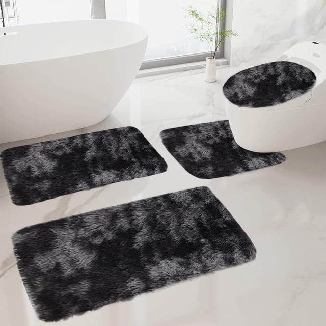 Ycandiee Bathroom Mat Set, a 4-piece bathroom rug set featuring soft, absorbent microfiber bath mats and a U-shaped contour toilet rug. The mats are plush, shaggy, and non-slip, designed for comfort and safety. Displayed in a modern bathroom setting with a white bathtub and toilet, the mats have a black and grey marbled pattern. Machine washable for easy maintenance.