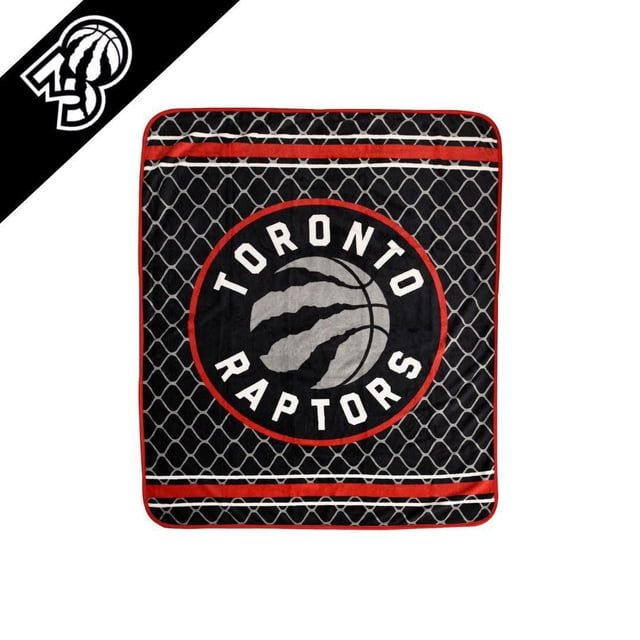 NBA Toronto Raptors Silky Soft Throw with black background and grey mesh netting pattern, red binding, and a central circular logo featuring a grey basketball with claw marks and 'Toronto Raptors' text, suitable for fans to stay warm and show team pride.