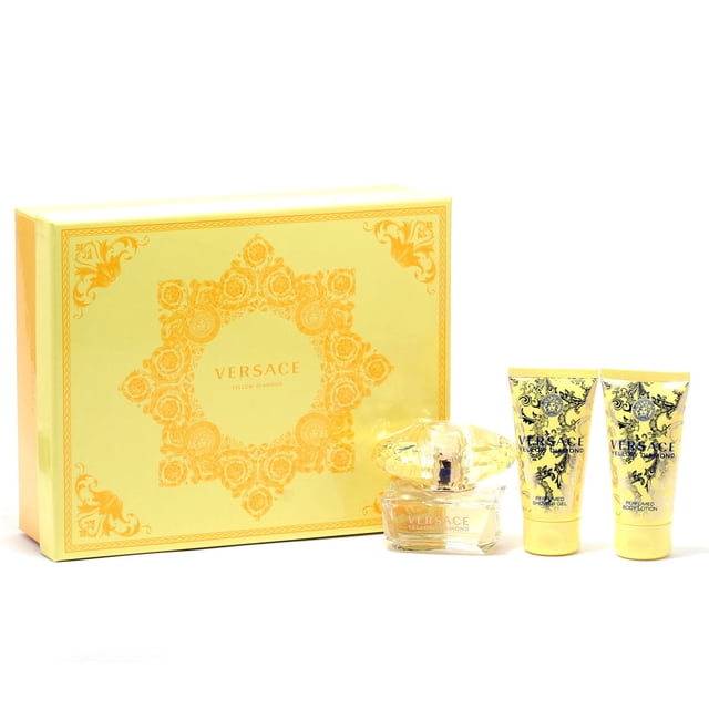 Versace Yellow Diamond Ladies - 50ML Edt Spray/50ml Shower Gel/50ml Body Lotion Set with a yellow decorative box, clear faceted perfume bottle containing yellow liquid, and matching yellow tubes of shower gel and body lotion featuring black baroque designs, offering a fruity floral scent with pear, lemon, mimosa, and musk notes, suitable for casual wear.