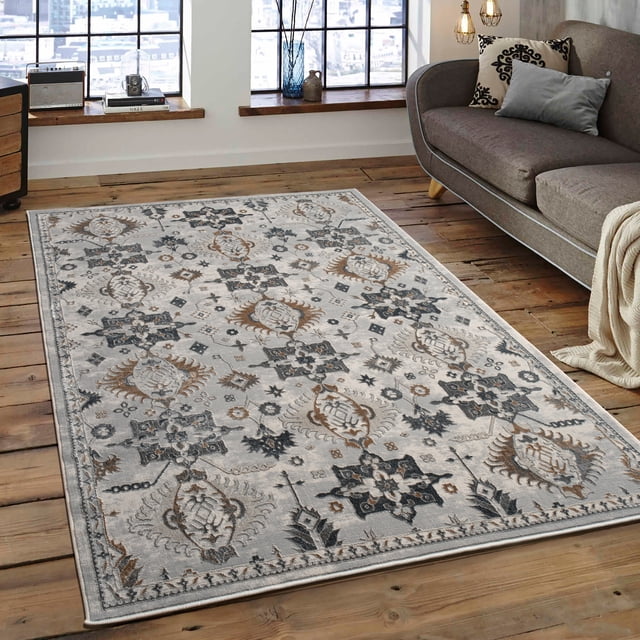 LaDole Rugs 3x10 ft Classic Premium Area Runner Rug in blue and grey, featuring a boho-inspired pattern with intricate floral and geometric designs. This long carpet is displayed in a cozy indoor setting with wooden flooring and a modern sofa, ideal for hallways, kitchens, or entryways. The rug has a soft texture, anti-slip jute backing, and a foldable design for easy storage and transport. Made in Turkey, it is machine washable and durable, ensuring long-lasting use.
