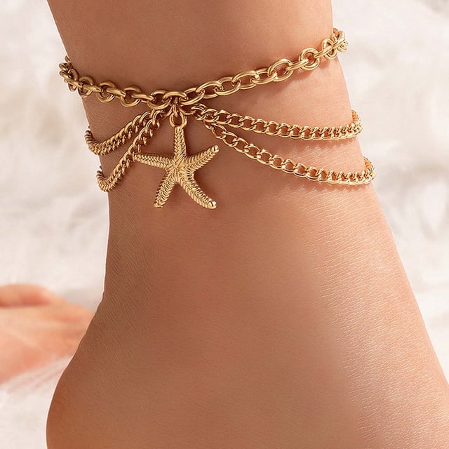 EGNMCR Layered Anklet Beach Heart Pendant Necklace for women, featuring a gold-plated alloy design with a starfish charm and multiple delicate chains. The anklet measures 24cm with a 5.5cm extension chain, offering an adjustable fit. Ideal for beach outings, weddings, or daily wear, this anklet adds a touch of elegance to any look. Perfect as a gift for occasions like Valentine's Day, anniversaries, or Mother's Day.