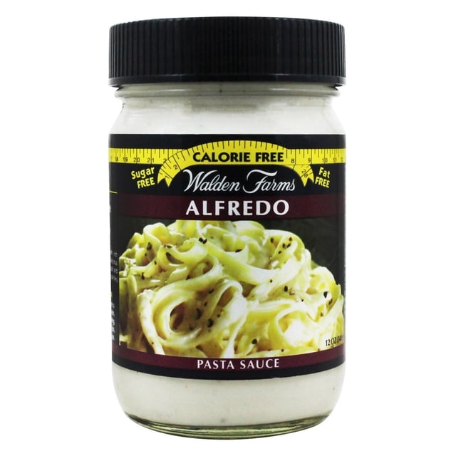 Walden Farms Calorie Free Pasta Sauce Alfredo in a 12 oz (340 g) jar. The label highlights its calorie-free, sugar-free, fat-free features and showcases an image of creamy Alfredo pasta. Made with natural Parmesan and Romano cheese flavors, sour cream, cracked black pepper, diced onions, and fresh herbs.