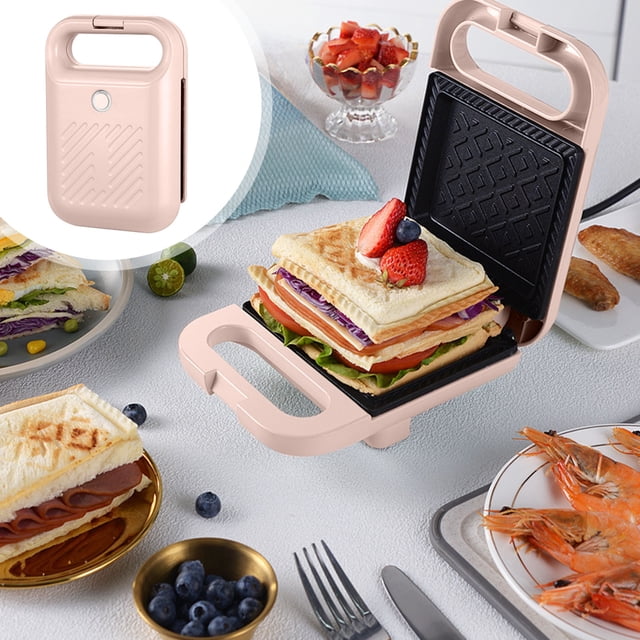 PEONAVET Metal Sandwich Breakfast Machine, a pink sandwich maker with a non-stick coating, shown open with a layered sandwich inside. The compact design features a locking handle and power indicator light, suitable for making toasted sandwiches, omelets, and more. Surrounding the machine are various food items, including shrimp, blueberries, and salad, highlighting its versatility. Inset image shows the closed sandwich maker stored upright.