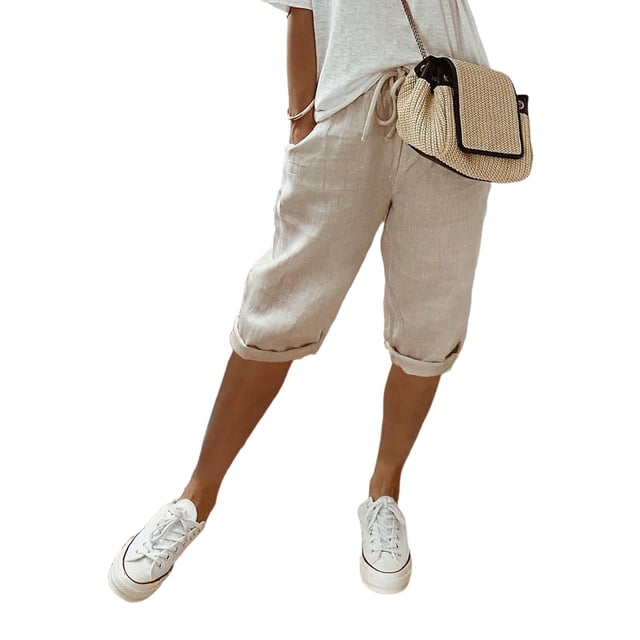 MAWCLOS Women's Bermuda Shorts in khaki, featuring an elastic drawstring waist, knee-length design, and solid color. Made from a soft and breathable blend of 65% cotton and 35% polyester, these shorts include side pockets and rolled cuffs. Styled for casual and summer occasions, they are paired here with white sneakers and a woven crossbody bag.
