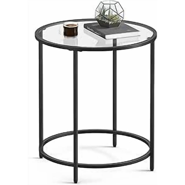 VASAGLE Table d'Appoint Ronde, avec Dessus en Verre Trempé et Cadre en Acier Noir. la Table Mesure 19,7 Pouces de Diamètre et 21,6 Pouces de Hauteur, au design Minimaliste Convenant aux Salons Ou comme Pièce d'Accent. la construction Robuste Supporte jusqu'à 88 Lb, et les Pieds Ajustables Assurent la Stabilité sur les surfaces Irrégulières. Montrée avec des Articles Décoratifs Incluant une Petite Plante et un Livre.