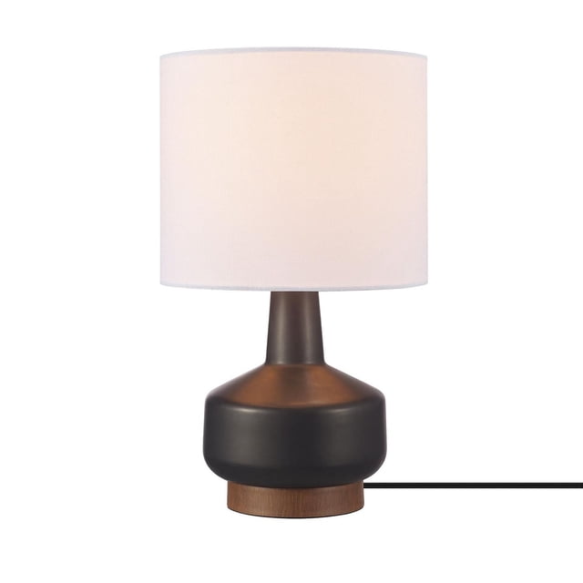 15" Matte Black Ceramic Table Lamp with Wood Toned Base and White Linen Shade featuring a matte black ceramic base with a warm wood toned accent and a cylindrical white linen shade that softly diffuses light, designed in a mid-century style compatible with E26 bulbs for versatile home lighting.