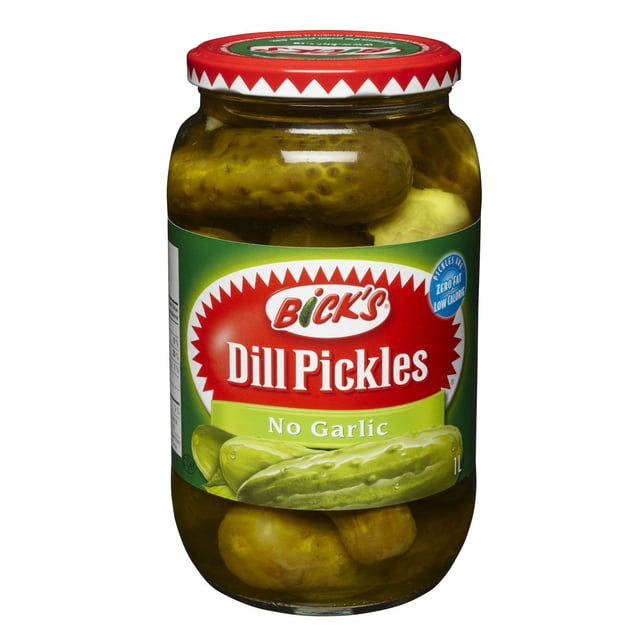Bick’s No Garlic Dill Pickles (1L) in a clear glass jar with a red and white zigzag lid, containing whole pickles submerged in brine, labeled zero fat and low calorie, ideal as a crunchy pantry condiment or topping for sandwiches and salads.