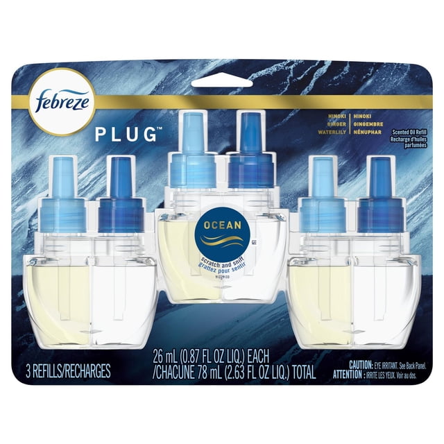Febreze Plug In Air Freshener, Odor-Fighting Scented Oil Refill, Ocean Scent, 3 Refills front-facing view of three clear refill bottles with blue ocean-tinted oil and Febreze labels, designed to fit Febreze plug-in units and plug into a wall outlet; features Fade Defy scent technology and ideal for bathrooms, kitchens and small closets, often used in linen closets for steady odor control.