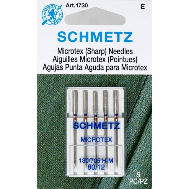 Schmetz® Microtex (Sharp) Needles size 80/12 in a clear plastic case with five needles, suitable for sewing machines and precise straight stitching on delicate and microfiber fabrics, placed on a green textured fabric background.