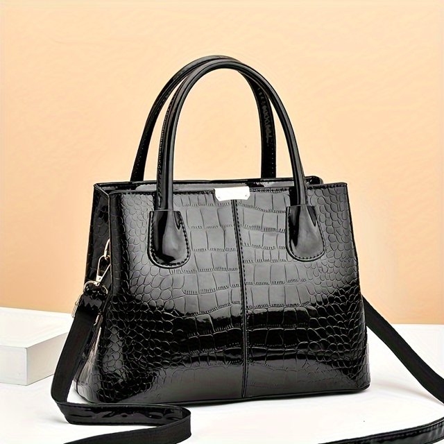Trendy Crocodile Print Tote Bag, Large Capacity Multi-pocket Shoulder Bag by GRM. This black faux leather tote features a crocodile-embossed texture, a solid color design, and a zippered closure. It includes dual top handles and a detachable shoulder strap for versatile carrying options. The interior is lined with polyester and offers multiple compartments for organized storage. Suitable for daily use or professional settings.