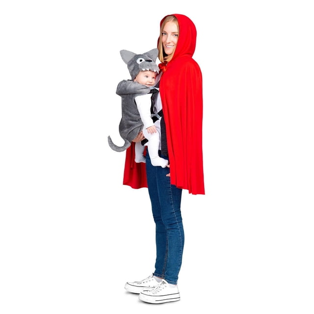 Adult Little Red Riding Hood and Little Wolf Baby Carrier Costume-One Size showing a side view of an adult wearing a red hooded cape and blue jeans, carrying a baby dressed in a gray wolf costume with a tail and hat in a front baby carrier, standing against a white background. This costume is ideal for Halloween and themed events.