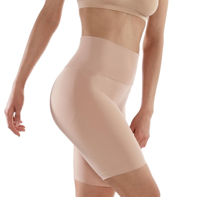 Secret Seamless Shaping Mid Thigh 1pk in nude beige, shown on a side profile of a model wearing high-waisted, mid-thigh length shapewear. Made from a REPREVE polyester blend with medium control shaping, featuring a wide double-layered waistband for tummy support, sideseam-free construction for comfort, and a cotton-lined gusset. Suitable for women's thigh shaping and intimate wear.