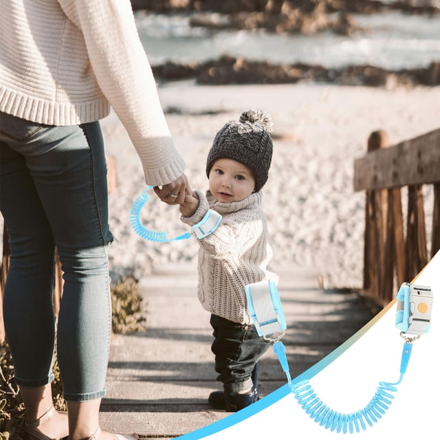 XYAIYT Child Safety Anti Loss Wristband with Magnetic Lock in light blue, shown in use by a parent and child outdoors. The wristband features a durable stainless steel and PVC traction rope, a breathable and soft wristband for comfort, and a 360-degree rotating design for flexibility. The magnetic induction lock ensures security, and the included 150 cm traction rope provides additional safety in crowded environments.