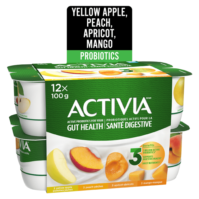 Activia Probiotic Yogurt 12-pack of 100g cups featuring yellow apple, peach, apricot, and mango flavors. The green and white packaging highlights active probiotics that support gut health and digestive wellness, with fruit images on each container. Suitable as a nutritious snack any time of day.