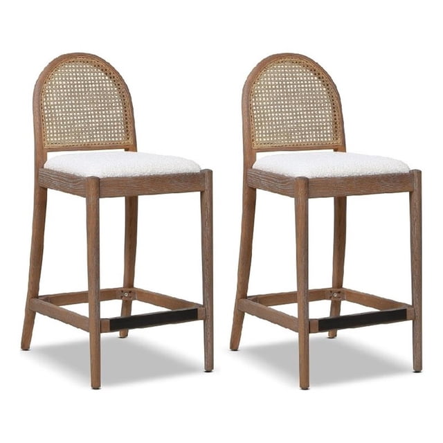 Panama 26.5" Curved Back Cane Rattan Counter Stool Set of 2 in Ivory White Boucle. Counter-height stools featuring a solid oak wood frame with a medium brown finish, natural cane webbing on the curved backrest, and off-white boucle upholstery with a faux lambskin texture. Includes a footrest with brass plate protection for ergonomic comfort. Ideal for kitchen seating or coastal, farmhouse, and mid-century modern decor.