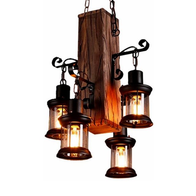 4-Light Wood Farmhouse Chandelier with a rustic design featuring a rectangular wooden base and four lantern-style pendant lights with E26 bases. The chandelier includes black metal accents and clear glass shades, creating a warm glow. Retro design suitable for dining rooms, kitchen islands, or living spaces. Adjustable chain for easy installation. Bulbs not included.