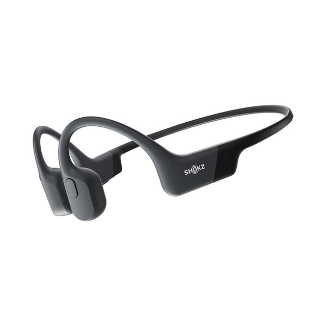 Shokz OpenRun bone conduction sports headphones in black with open-ear design and curved transducers resting on cheekbones, lightweight flexible frame, ideal for running and outdoor activities, offering 8 hours of music and calls.