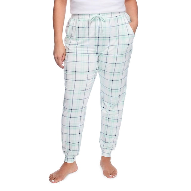 George Women's Plus Peached Sleep Jogger in light plaid peached jersey knit fabric with elasticized waistband and drawstring, two slash pockets, and fitted cuffs, designed for comfortable women's sweatpants and loungewear, shown front-facing on a model with hands in pockets.