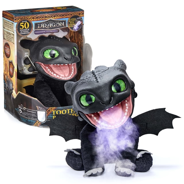 How to Train Your Dragon Toothless Puppetronic by Real FX is a black dragon figure with textured skin, large green eyes, open mouth emitting purple smoke, and outstretched black wings, shown with its branded packaging highlighting over 50 interactive sound and action features, suitable for imaginative play.