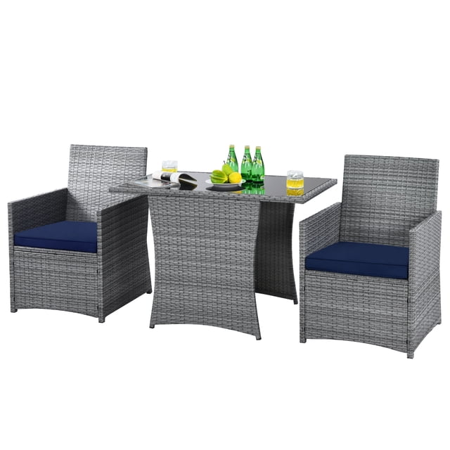 Patiojoy 3PCS Patio Rattan Furniture Set featuring a mixed gray rattan design with a tempered glass-top table and two chairs with navy cushions. The set is made of durable steel and PE rattan, suitable for outdoor spaces like patios, gardens, and balconies. The chairs have ergonomic backrests and thick, breathable cushions for comfort, while the table provides ample space for drinks and decor. Includes non-slip feet pads for stability and easy assembly instructions.